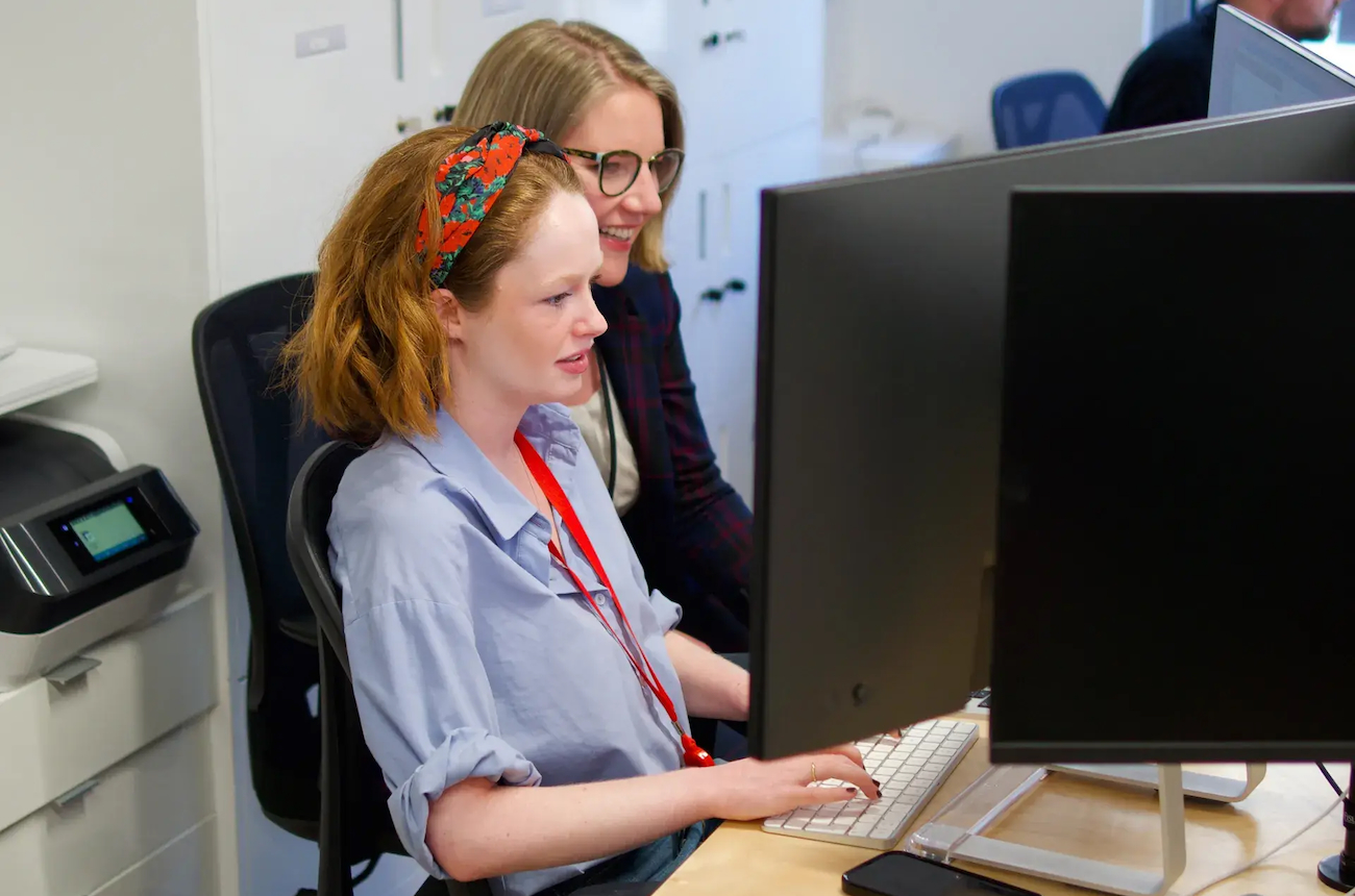 Team members around a computer