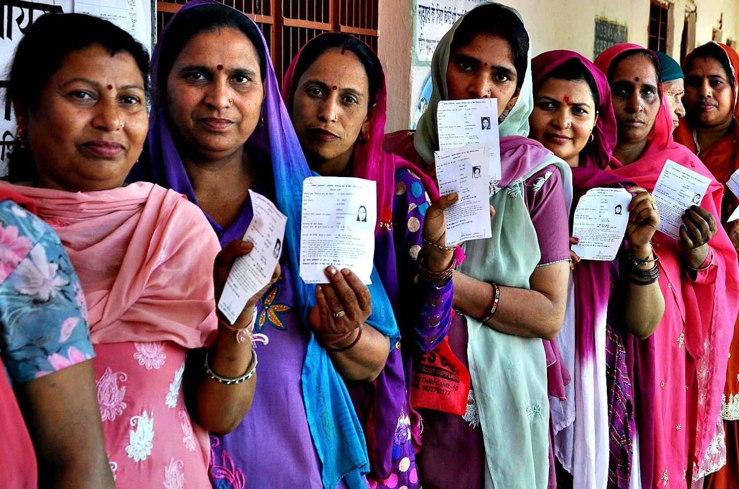 Women showing their IDs